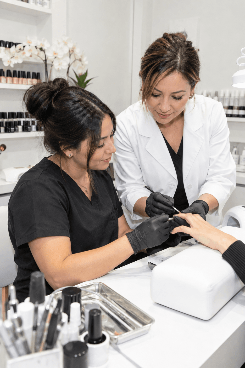 A team mentor supporting a colleague as they care for a client